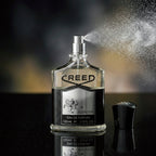 Creed Aventus perfume spray with elegant mist highlighting fresh and smoky fragrance from Perfumesouq Qatar 