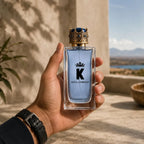 Man holding Dolce & Gabbana K Eau de Toilette 100ML perfume bottle | Perfume Souq Qatar