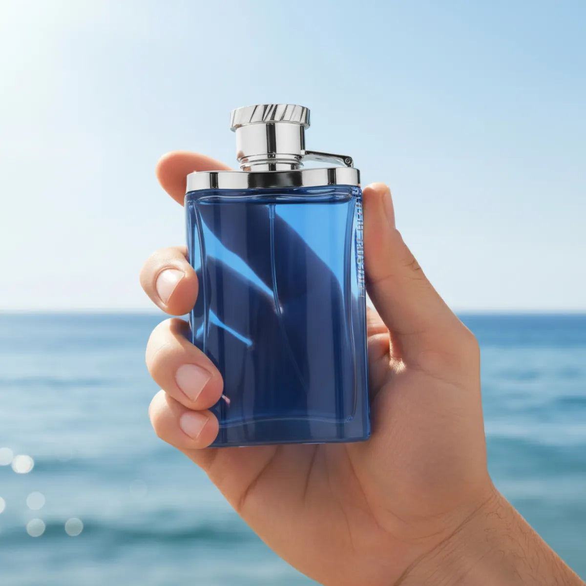 Man holding Dunhill Desire Blue Eau de Toilette 100ML perfume bottle | Perfume Souq Qatar