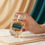 Woman holding Elie Saab Le Parfum Royal EDP perfume bottle | Perfume Souq Qatar